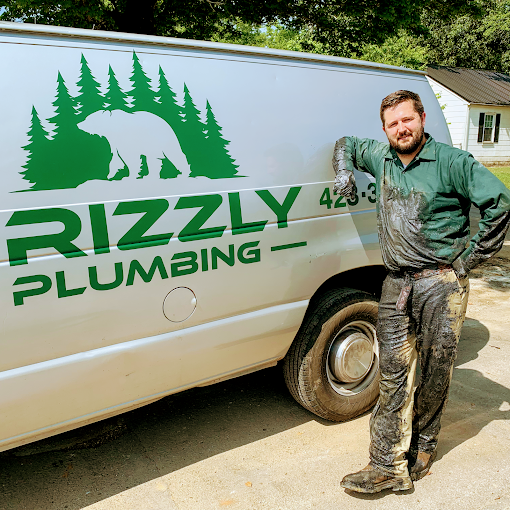 Grizzly Plumbing technician and van in Cleveland, TN