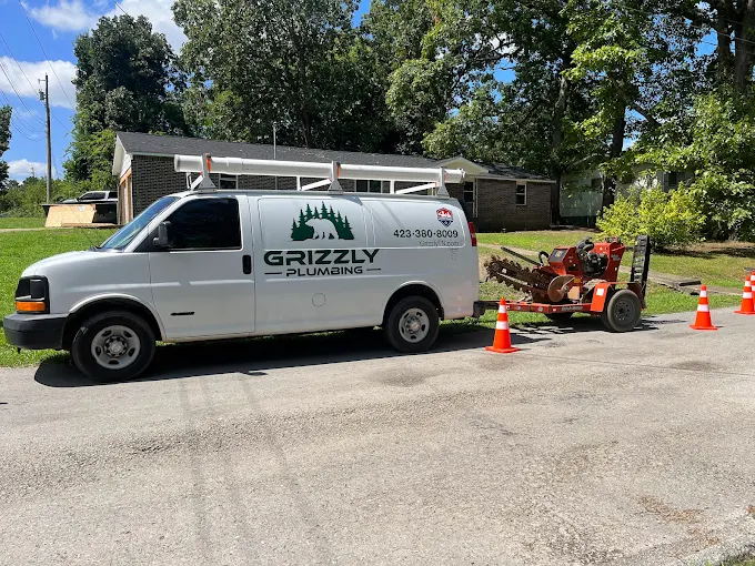 Grizzly Plumbing van and trencher