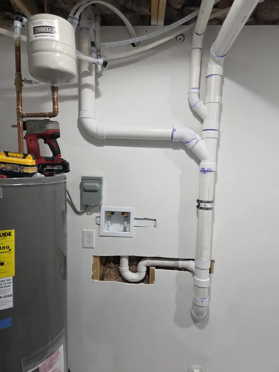 Water heater installed with rebuilt drain lines by Grizzly Plumbing